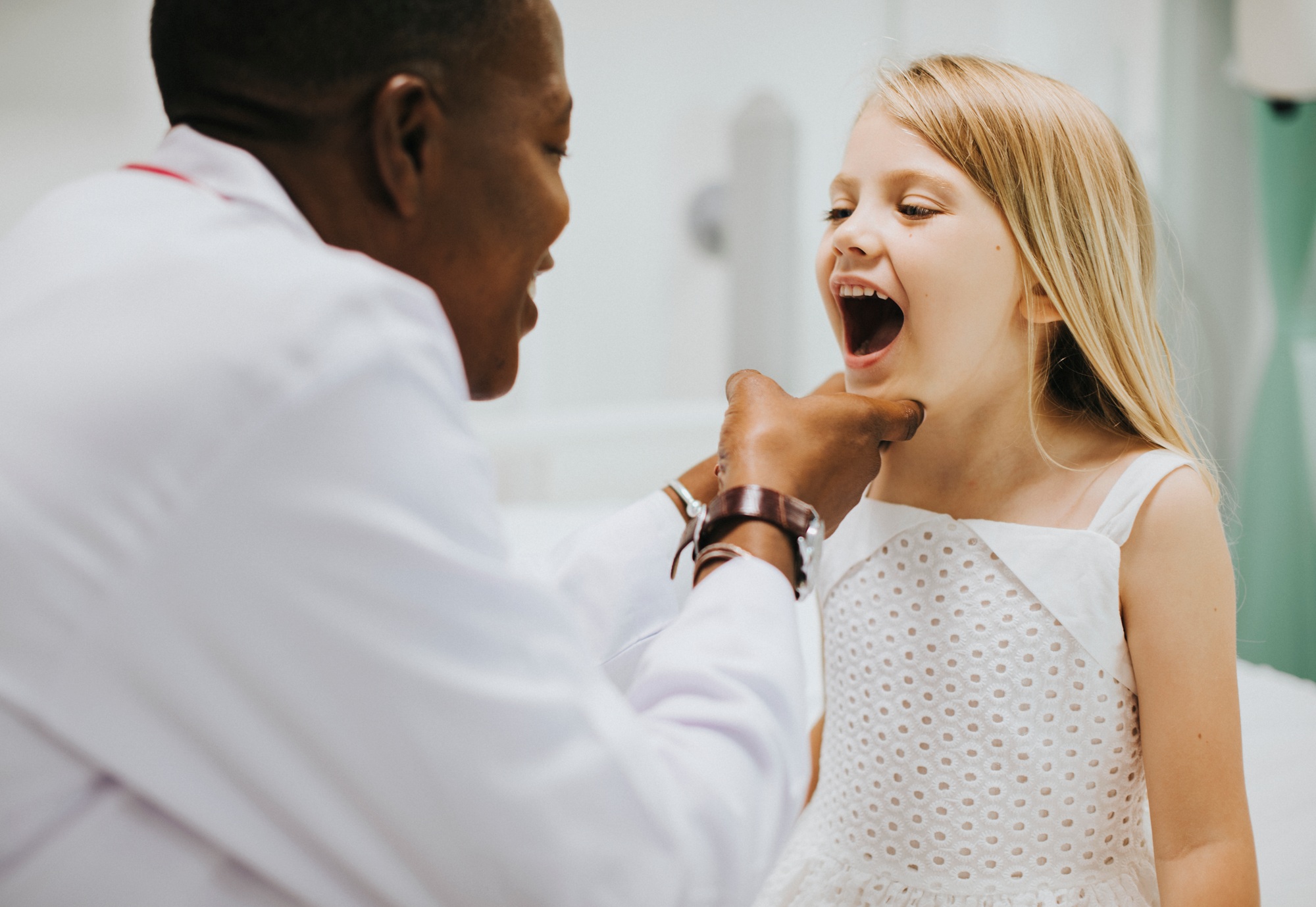 young-girl-showing-a-dentist-her-teeth.jpg